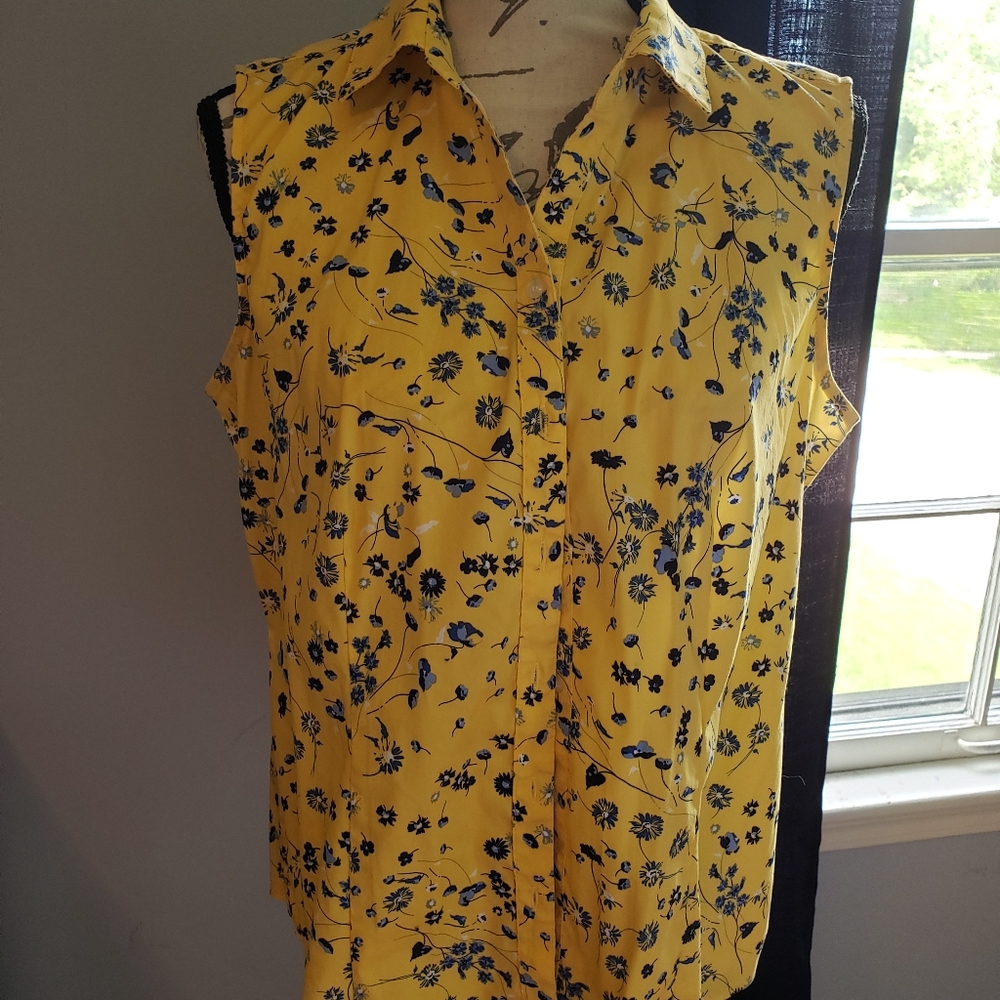 Yellow sleeveless blouse with floral pattern